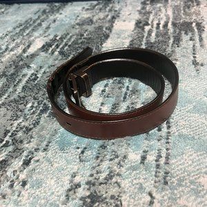 brown and black belt that is in full tact